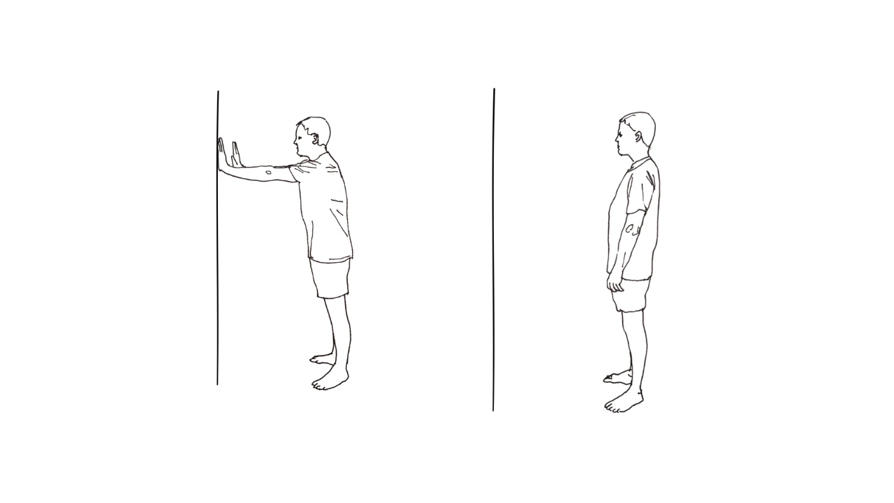 A man exercising wall lean hold.